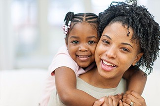 smiling mother and daughter